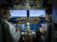 Rear view of two pilots flying a Boeing 737 MAX. Iridium sees opportunity in Long-Haul.