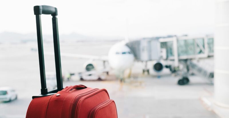 red suitcase at airport Image: SITA