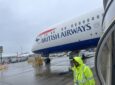 British Airways aircraft is parked at the gate.