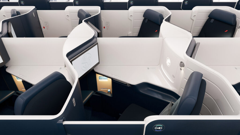 Air France business class seat is white with grey and blue accents.