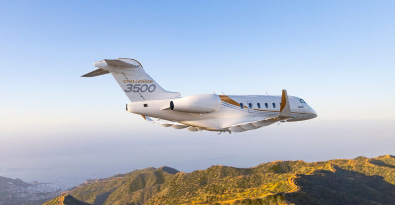 Bombardier Challenger 3500 in-flight over mountains. This aircraft will now offer Iridium Certus satcom as baseline, according to Bombardier.