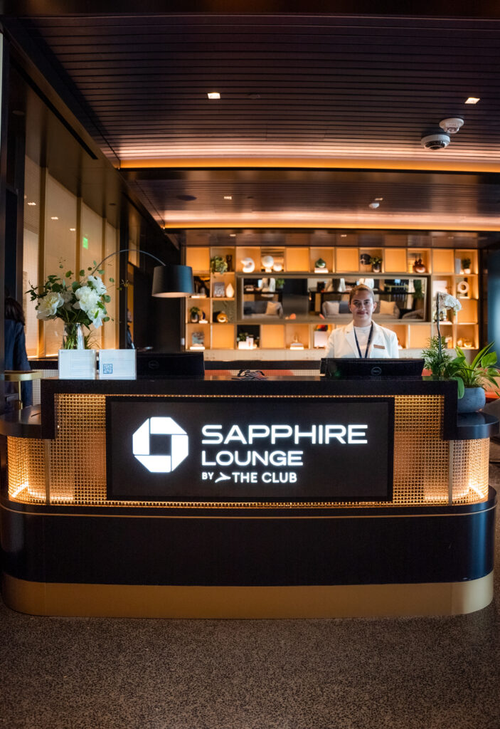 Welcome desk in the Chase Sapphire Lounge by the Club at Boston Logan International Airport