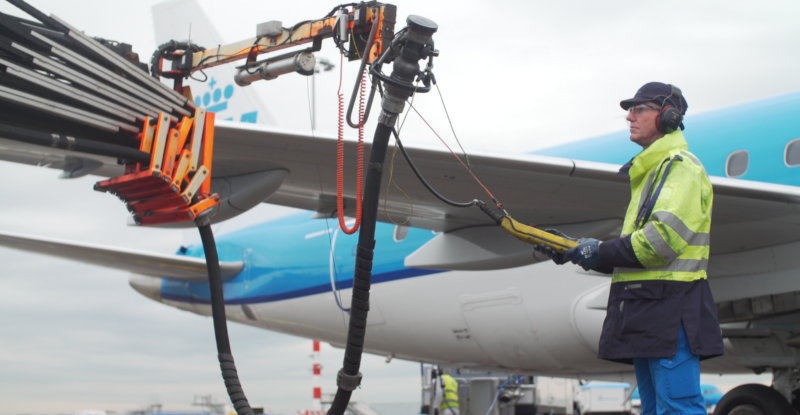 A man is monitoring the fueling of a KLM aircraft with SAF. They have selected GE Aerospace for fuel Insight software