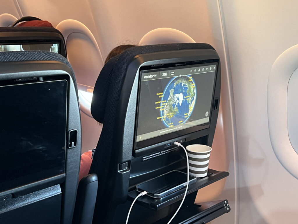 A small mini ledge pokes out of the seat back. It provides enough room for a phone and a coffee cup.