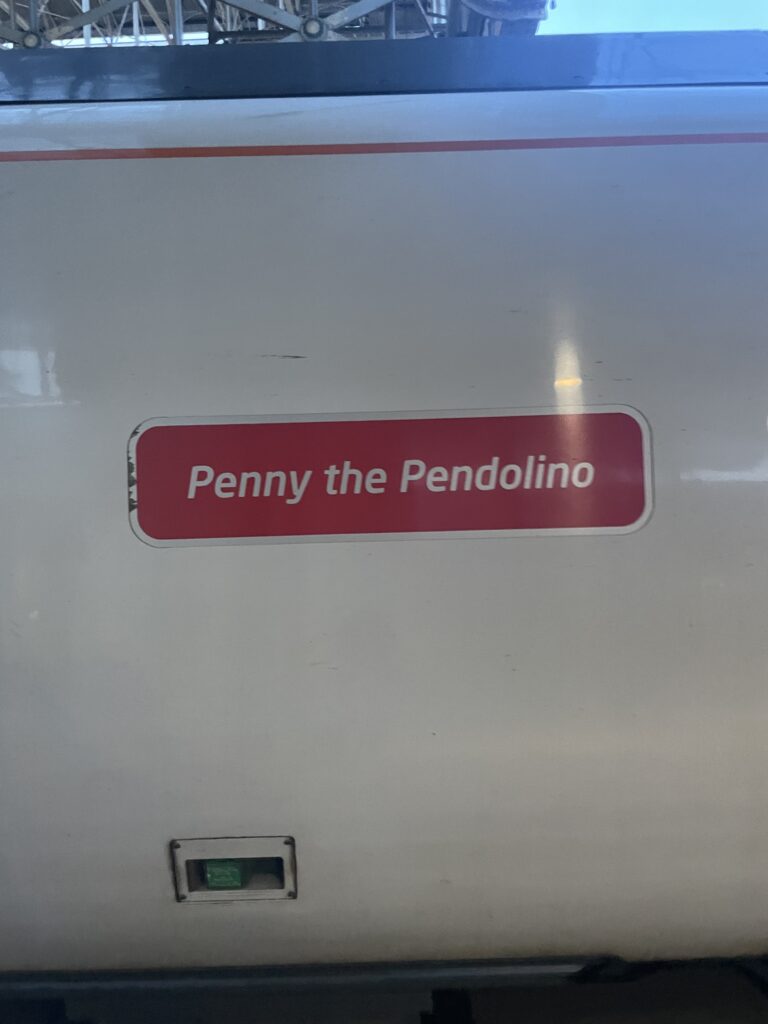 "Penny the Pendolino" wording on the train.