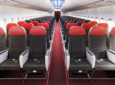 The cabin interior for Vietjet Boeing 737 MAX. A red carpet is in view and each Safran Z200 seat has a red headrest.