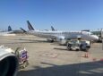 Air France A220 parked and ready to board on a sunny day