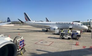 Air France A220 parked and ready to board on a sunny day