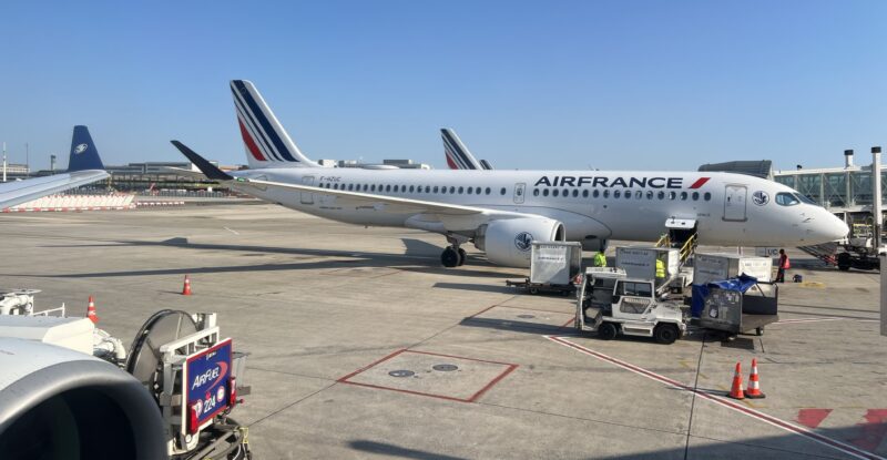 Air France A220 parked and ready to board on a sunny day