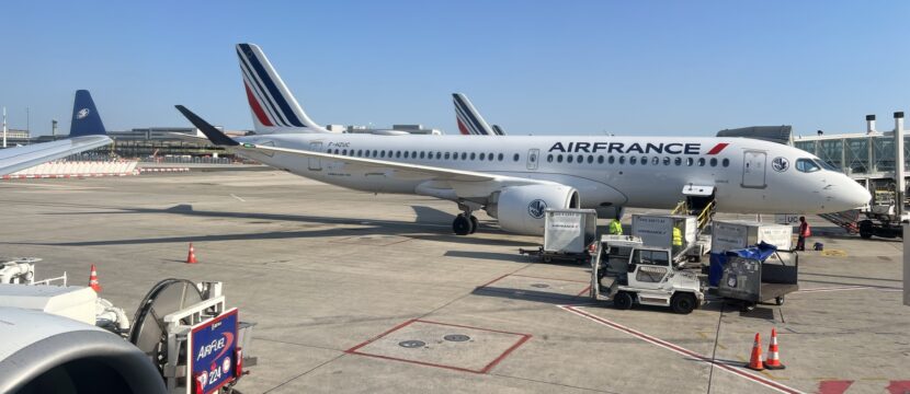 Air France A220 parked and ready to board on a sunny day