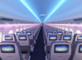 Airbus Airspace Cabin for the A220 is in a 2-3 layout and being lit by blue and purple LED lights.
