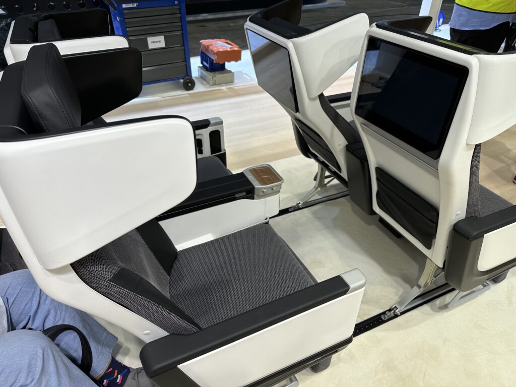 Massive IFE screens on the seatbacks of the PL3810s on the show floor