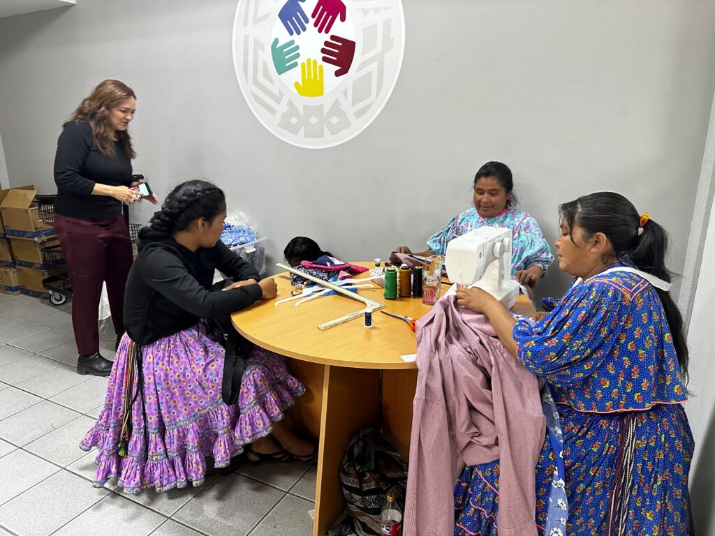 Artisans’ cooperative from the local Tarahumara people who work with Soisa. Women are sewing at a communal table. 