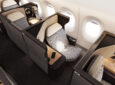 The business class seat on the Qantas A350 is all grey with a white head rest.