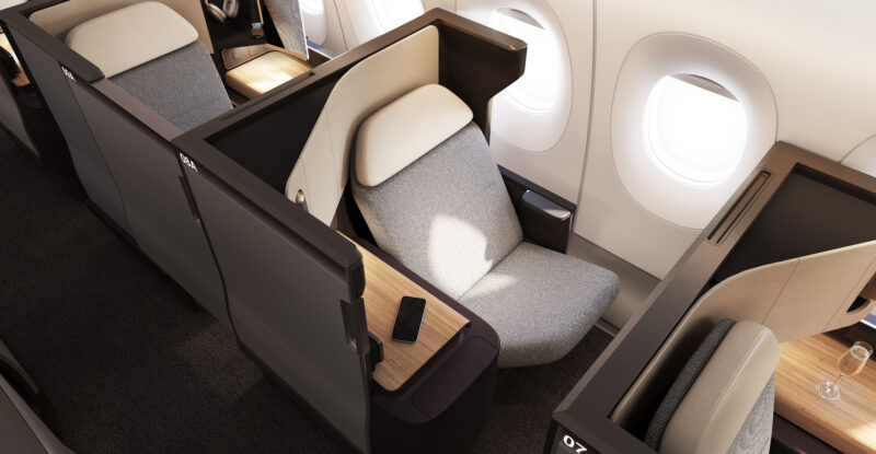 The business class seat on the Qantas A350 is all grey with a white head rest.