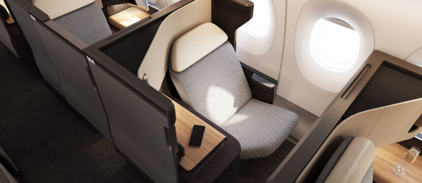 The business class seat on the Qantas A350 is all grey with a white head rest.