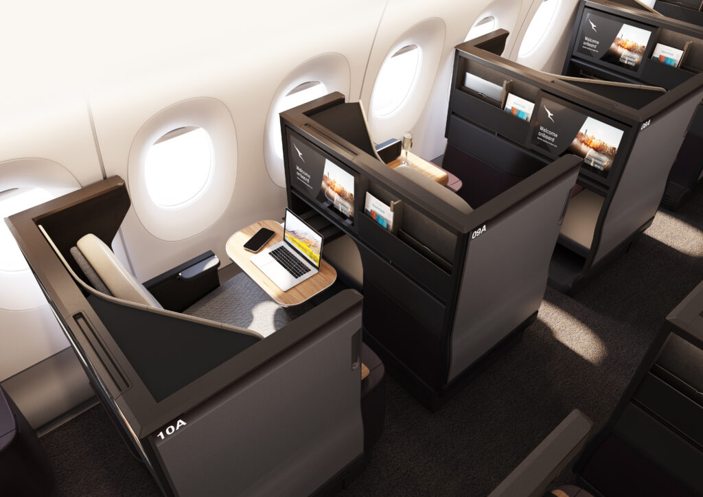 The business class seat on the Qantas A350 is all grey with a white head rest.