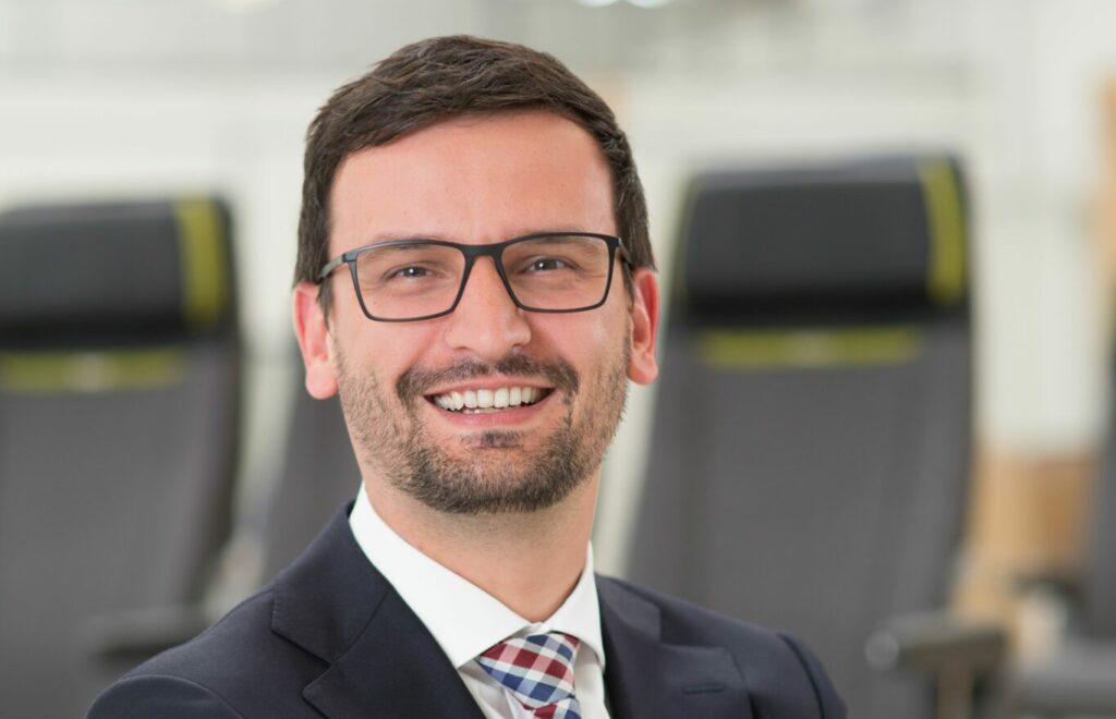 Roland Grimm, pictured here smiling, joins the RECARO Aircraft Seating Executive Board as EVP Supply Chain & Sustainability