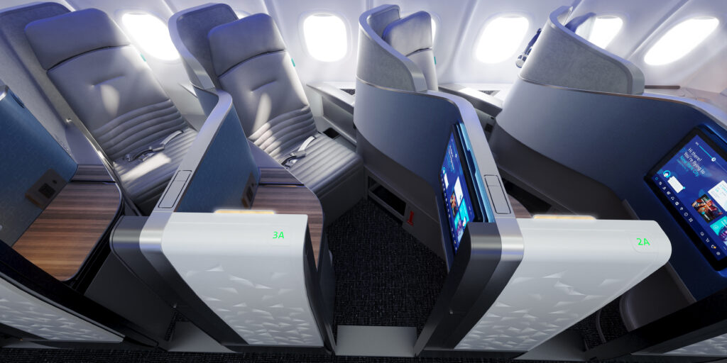 Pictured, the JetBlue business class seat is all sleek grey with a bright light coming from the aircraft window. coffin