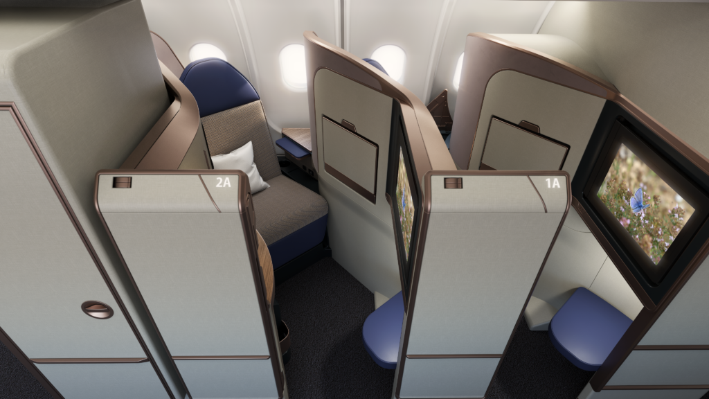 The Aurora business class seat is pictured here in grey with a blue headrest on an aircraft. The seatback is pushed well back within the space.