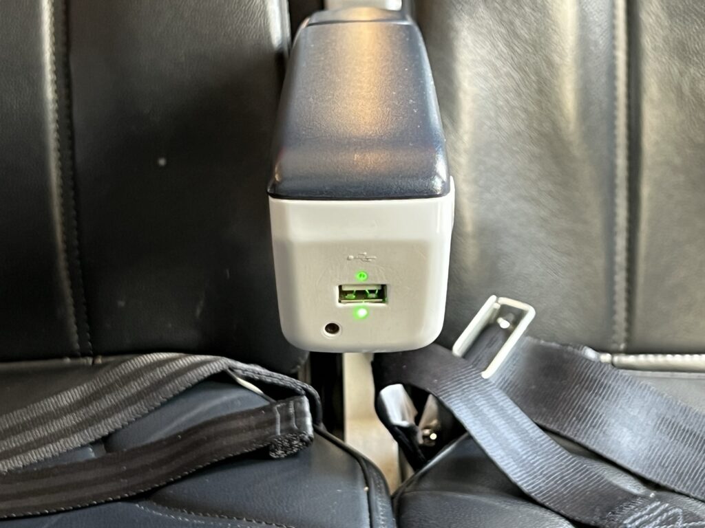 USB-A power charging port in the armrest of the Air France A320.