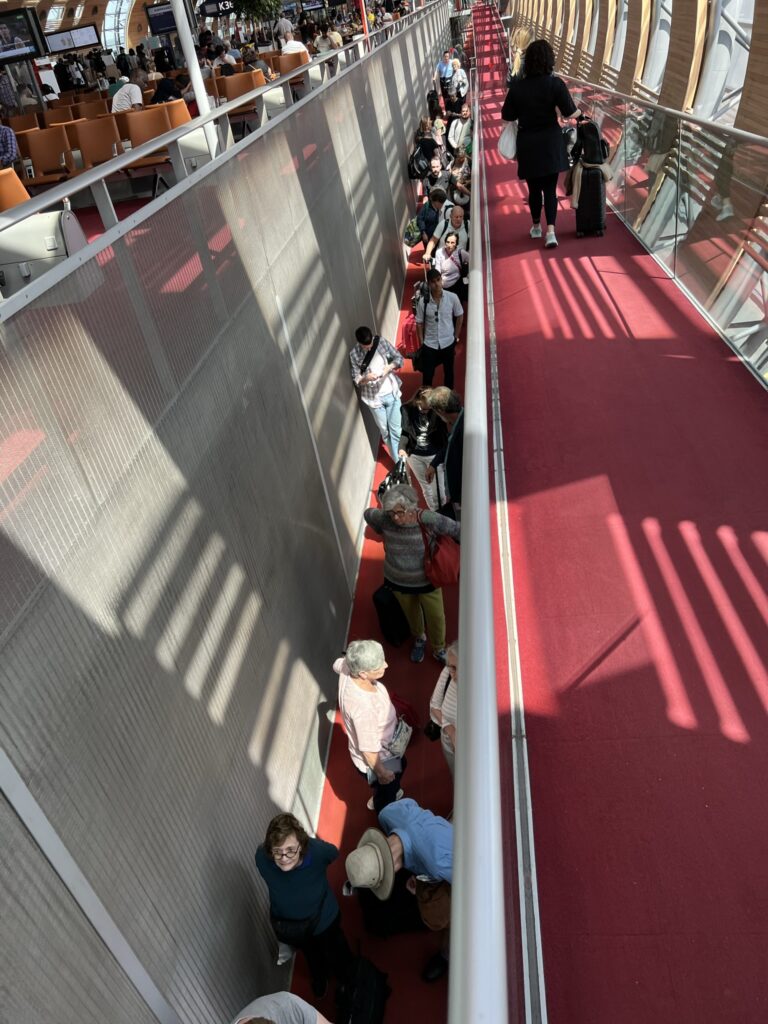 Passengers line up to reach their connecting flights. 