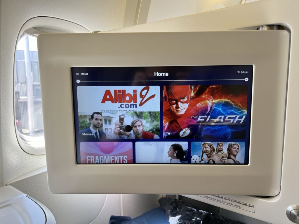 The movie selection on a large IFE screen in business class aboard the Air France 777 .