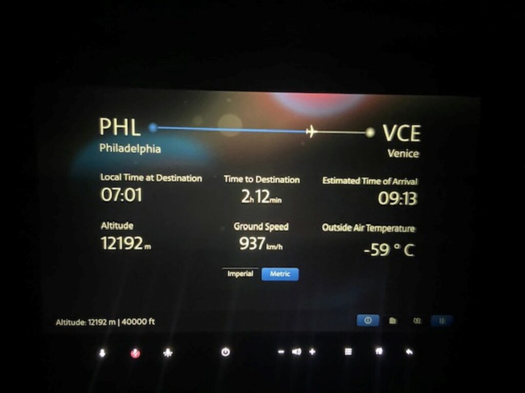 The embedded IFE screen on an American Airlines Boeing 787 showing the trip information from PHL to VCE