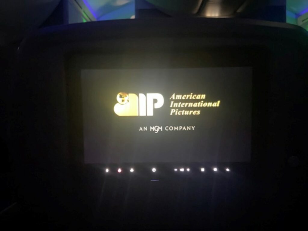 The AIP "American International Pictures" logo is on the embedded IFE screen of the Boeing 787 by American Airlines. 