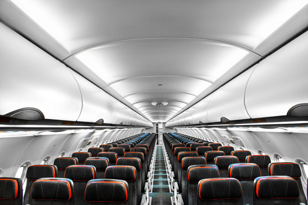 Inside the cabin of the Avianca reconfigured A320 with more fully-featured seats up front and a more basic economy product down back.