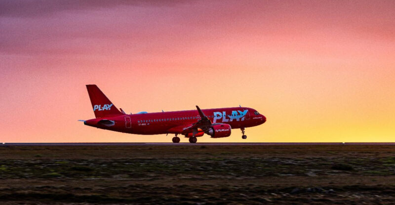 PLAY aircraft on the runway at sunset. Image PLAY