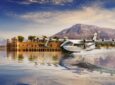 Rendering of a Jekta PHA-ZE 100 amphibious aircraft landing on water near a vessel.