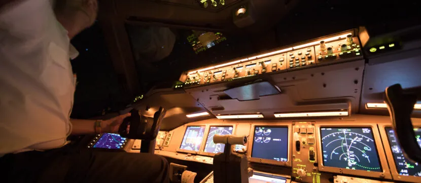 A 777 cockpit on a flight from Amsterdam. The ACARS system is clearly in view. LEO