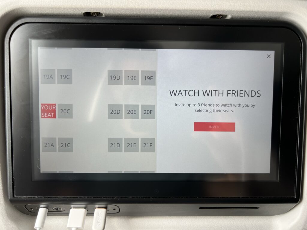 The screen displays a "watch with friends" option.