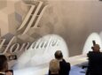 Hondajet logo is displayed on a large wall during a press reveal.