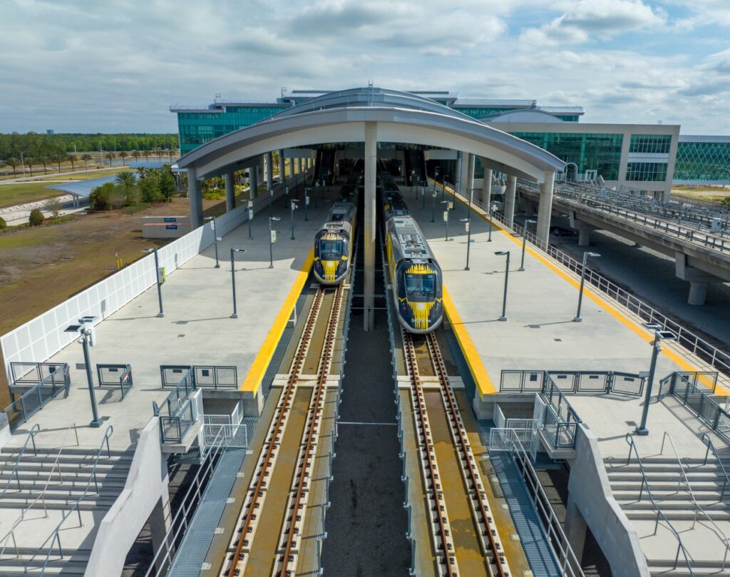 Brightline Orlando Station Platform shows two trains coming in.