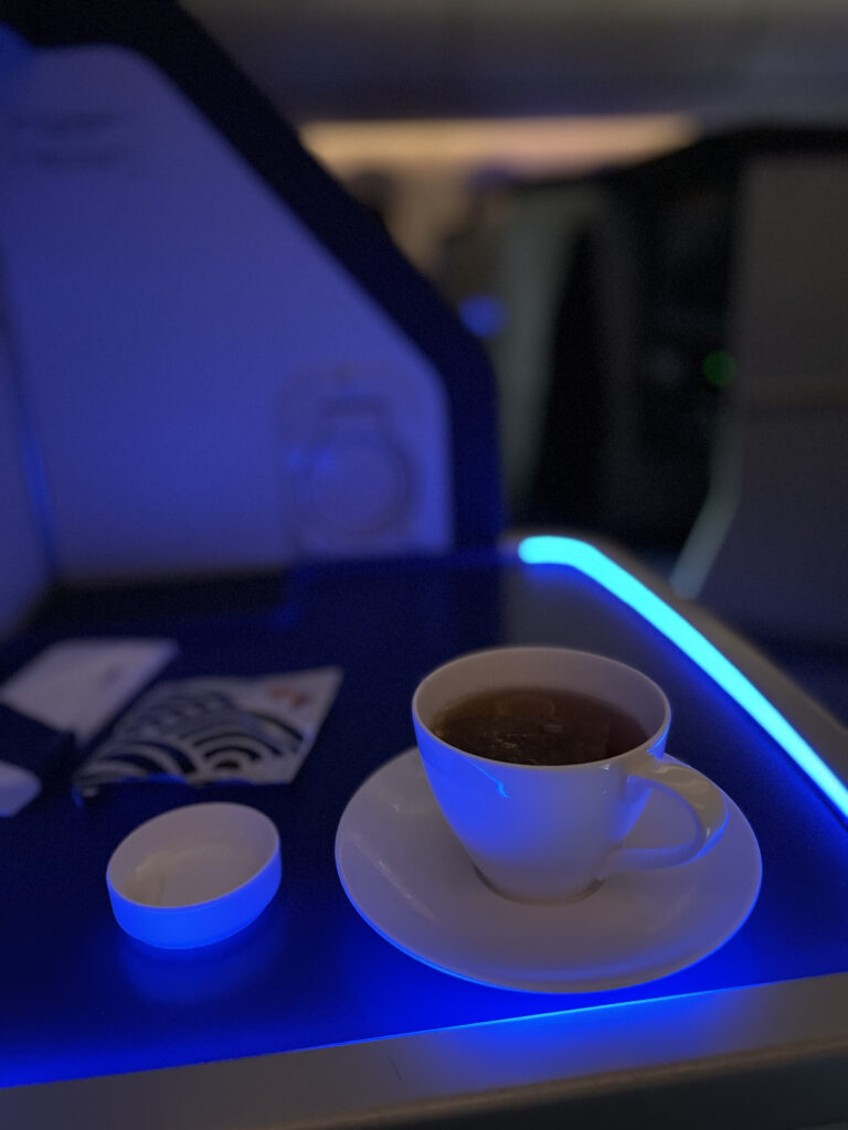 Tea service in ANA business class under the blue LED lights. 