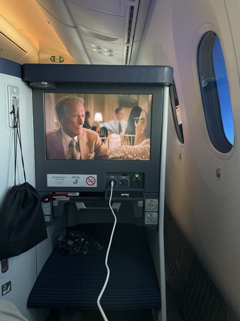 A view of the 17" IFE screen in the ANA business class seat as it plays a movie.