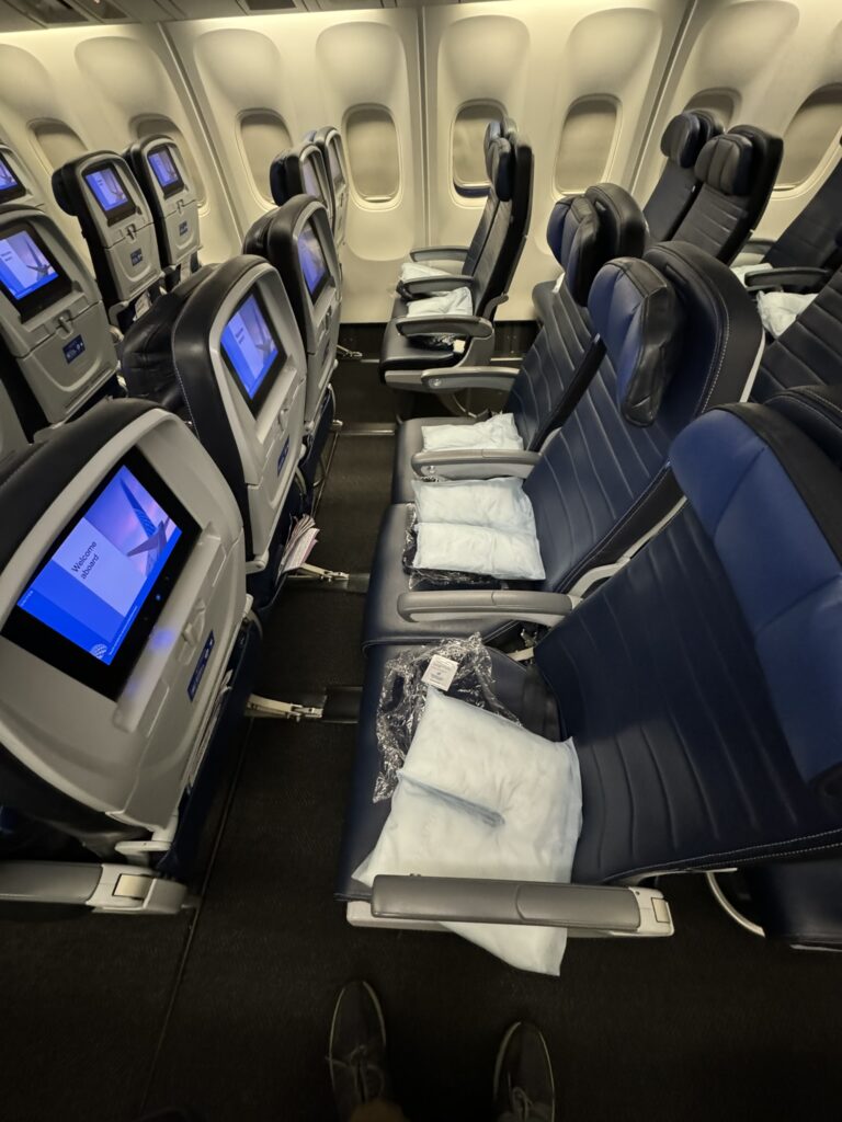 Economy class seats on the 767-300ER are all blue and feature seatback IFE. 