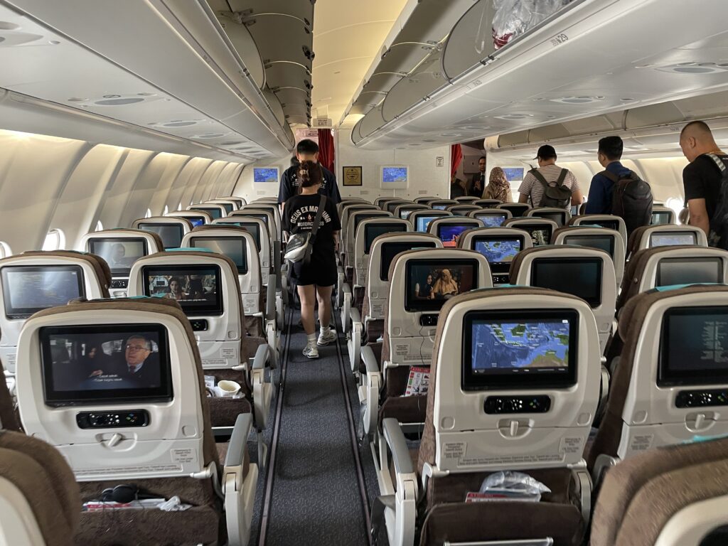 A rear view on the Garuda Indonesia A330 cabin as passengers deplane. 