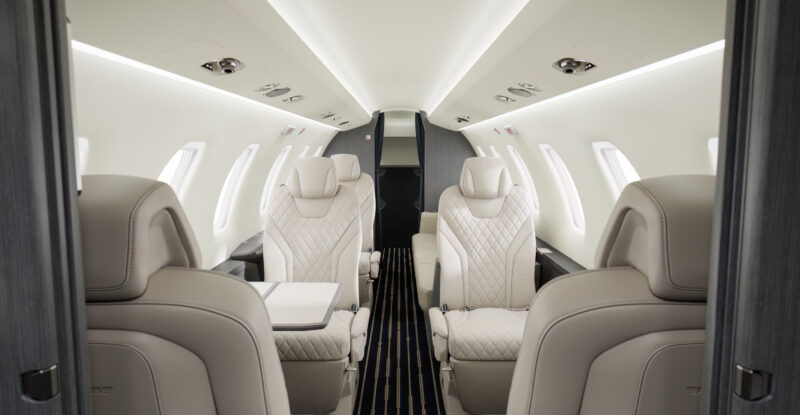 The cabin interior of the Pilatus PC-24. Plush white seats sit in 1-1 layout.