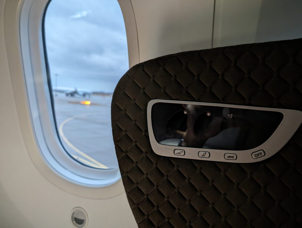 The Singapore Airlines business class seat on the 787-10 blocks one of windows.