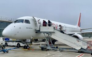 Passengers board aircraft operated by Hop