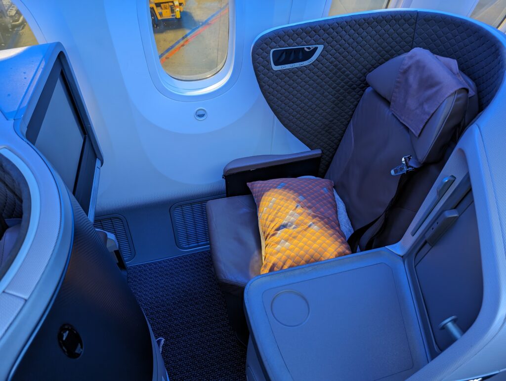 Top down view of the Stelia Symphony seat on Singapore Airlines' 787-10. Blue LED lights cast a pretty glow on this window business seat. 