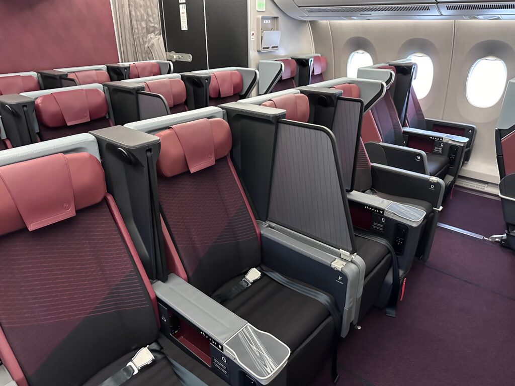 JAL A350 premium economy cabin, with generous privacy screens.