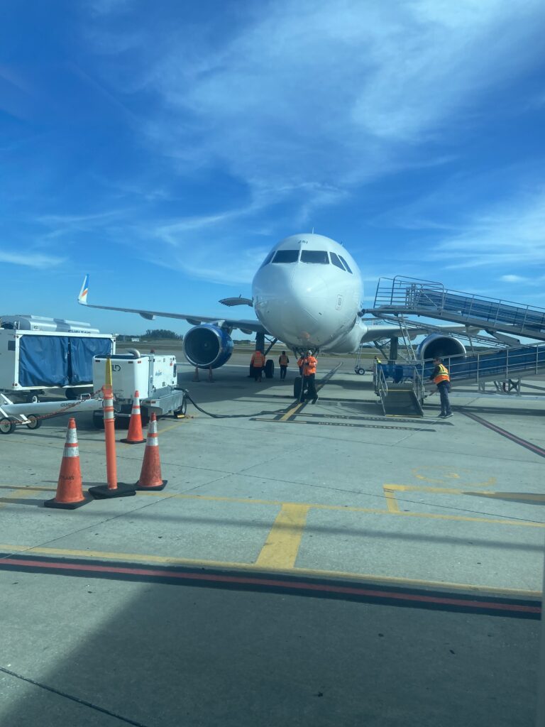 The nose of the Allegiant aircraft as seen from the gate.