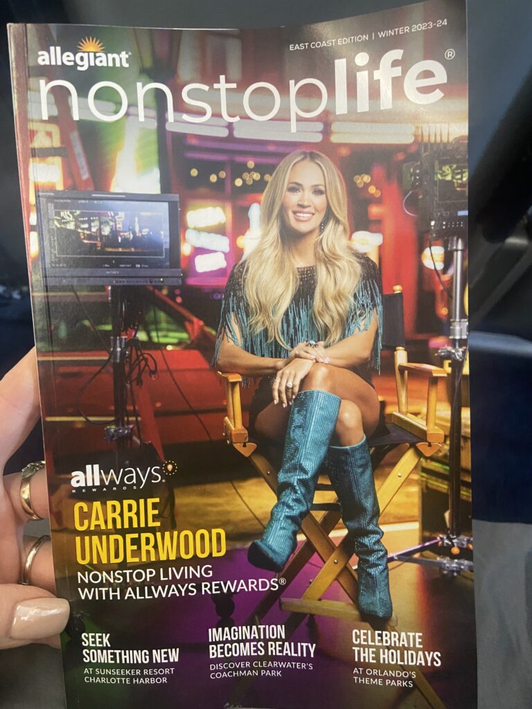 Carrie Underwood is pictured on the inflight magazine being held up.