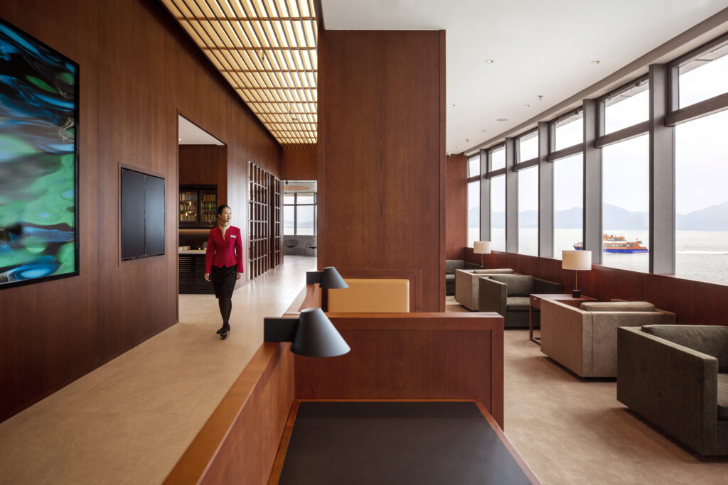 The interior of the longe, with various types of wood used for paneling, furniture and art.
