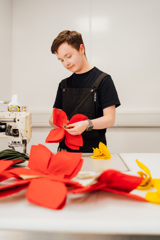 Jamie O’Donnell, Lead Aviation Designer at Muirhead, making leather flowers