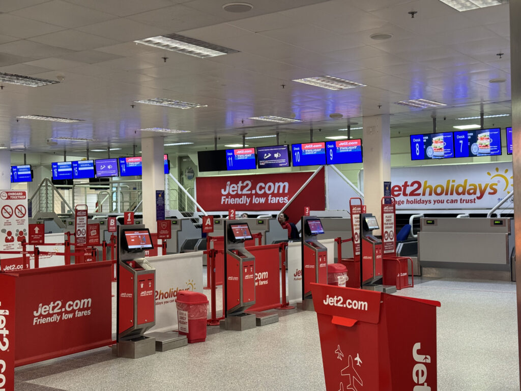 Jet2 red branding is seen everywhere at checkin. 